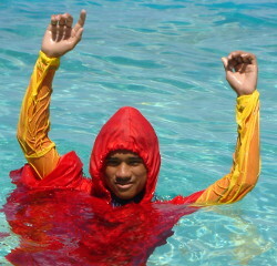 Lifeguard signals both hands up danger